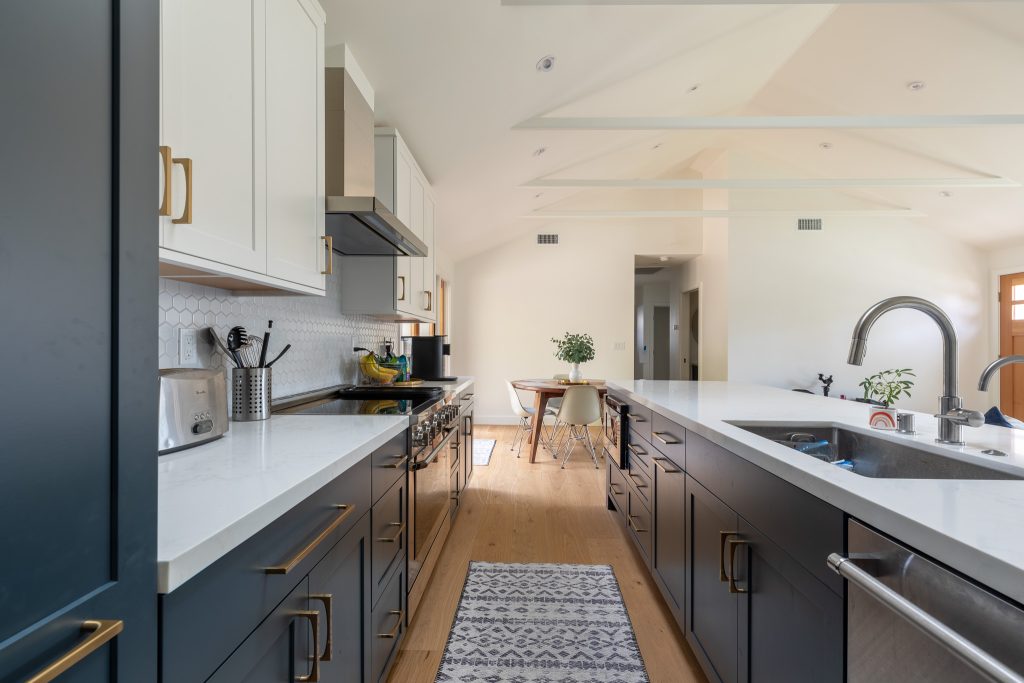 Culver City Living Room with Blue Cabinets, White Counter Top, and Real Wood Floors.
